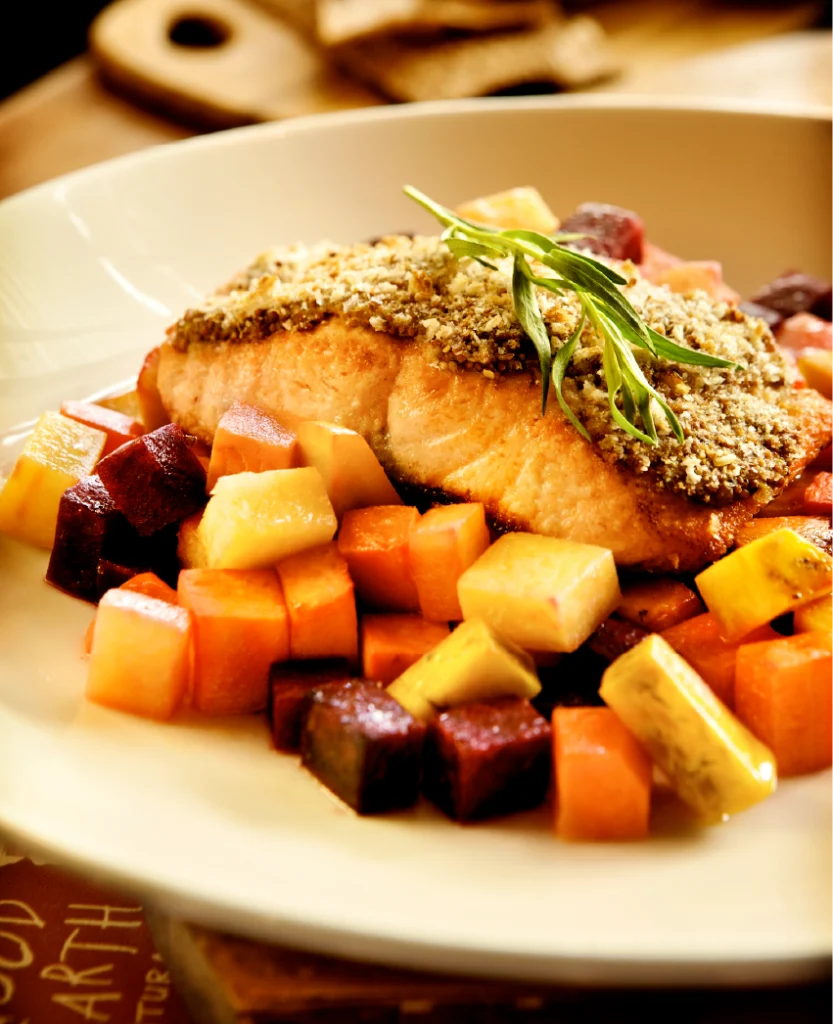 Grilled seafood on a bed of fall vegetables at Good Earth